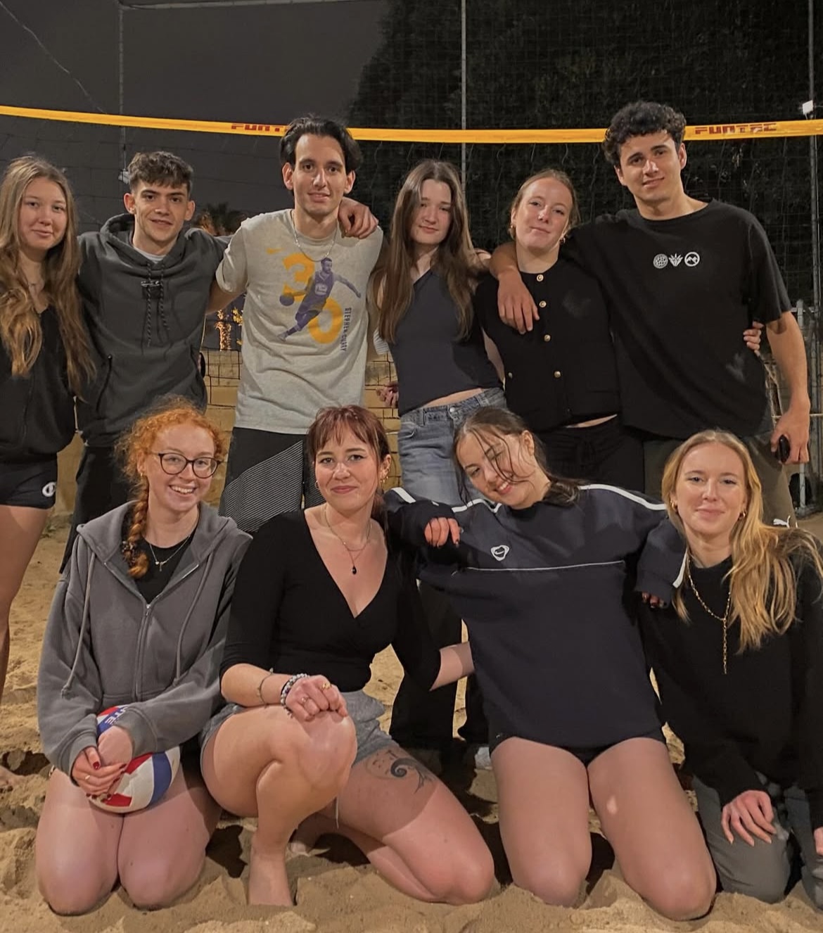 My friends and I playing volleyball in the evening